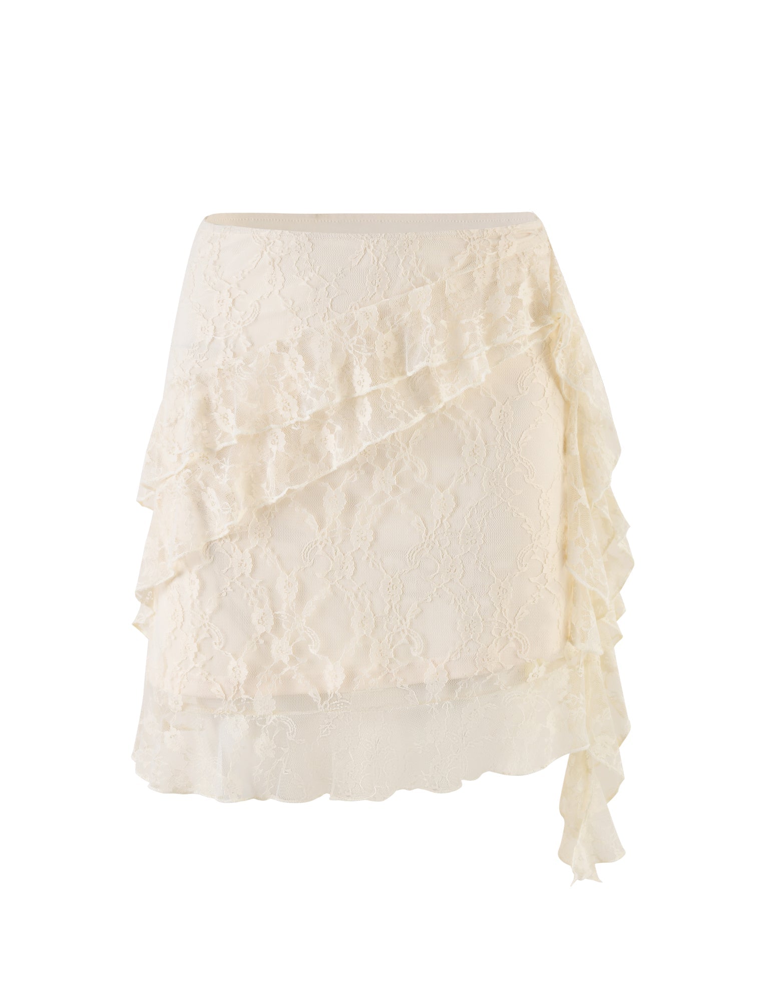 The STORMI LACE SKIRT - BEIGE : CHAMPAGNE : CHAMPAGNE LACE from TIGERMIST is a beautifully elegant mini skirt in a delicate cream color. It features a refined overlay design adorned with cascading ruffles that diagonally sweep across the front and culminate in an extended ruffle on the right side, forming an asymmetrical hem. With its fitted waist, this skirt boasts a soft and sophisticated texture.